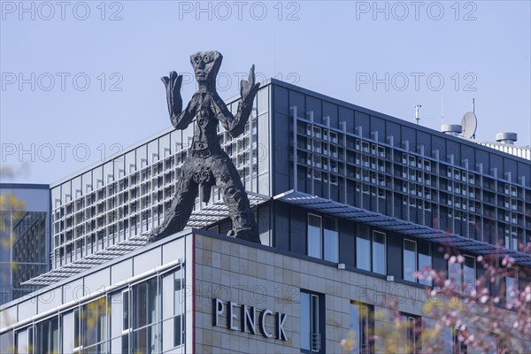On the acute-angled corner of the building at the junction of Maxstrasse and Ostra-Allee stands a four-metre bronze sculpture of a stick figure created by A. R. Penck, Dresden, Saxony, Germany, Europe
