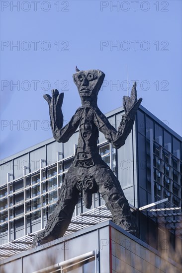 On the acute-angled corner of the building at the junction of Maxstrasse and Ostra-Allee stands a four-metre bronze sculpture of a stick figure created by A. R. Penck, Dresden, Saxony, Germany, Europe