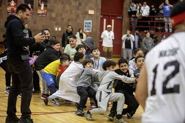 Hamtramck, Michigan USA, 8 March 2024, Arab-Americans from Hamtramck and Dearborn, Michigan faced off in a charity fundraising basketball game and, during halftime, a children's tug-of war. The event raised money for charities in Palestine and Yemen
