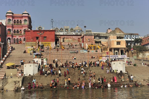 People gather at a busy stretch of stairs by the river, Varanasi, Uttar Pradesh, India, Asia