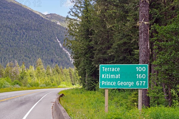 Road sign with distances on the Yellowhead Highway, no traffic, wilderness, Terrace, Kitimat, Prince George, British Columbia, Canada, North America
