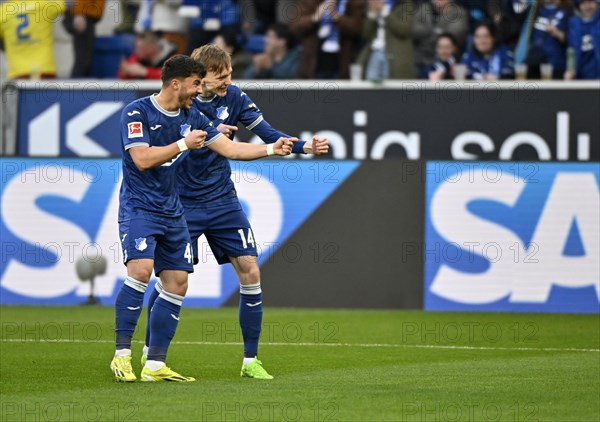 Goal celebration Maximilian Beier TSG 1899 Hoffenheim (14) and Umut Tohumcu TSG 1899 Hoffenheim (40), gesture, rifle, bow and arrow, SAP logo, PreZero Arena, Sinsheim, Baden-Wuerttemberg, Germany, Europe