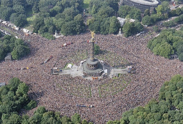 Aerial view of the Victory Column during the Love Parade. Under the motto One World one Future, techno music fans celebrate the 10th Love Parade with more than one million visitors in Berlin on 11 July 1998