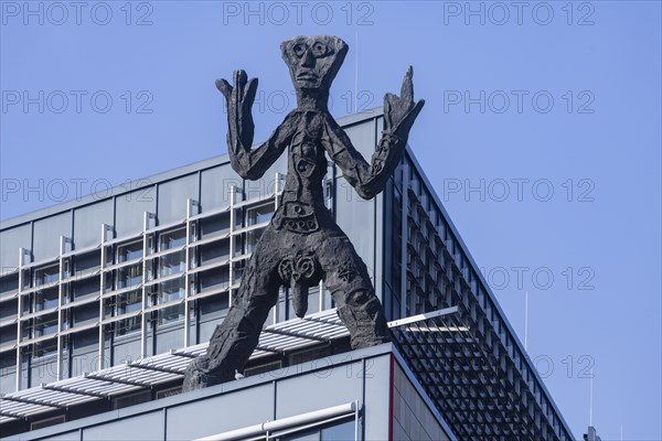 On the acute-angled corner of the building at the junction of Maxstrasse and Ostra-Allee stands a four-metre bronze sculpture of a stick figure created by A. R. Penck, Dresden, Saxony, Germany, Europe