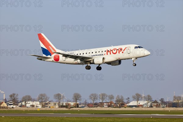 Air France Hop Embraer E170LR with the registration F-HBXN approaching the Polderbaan, Amsterdam Schiphol Airport in Vijfhuizen, municipality of Haarlemmermeer, Noord-Holland, Netherlands