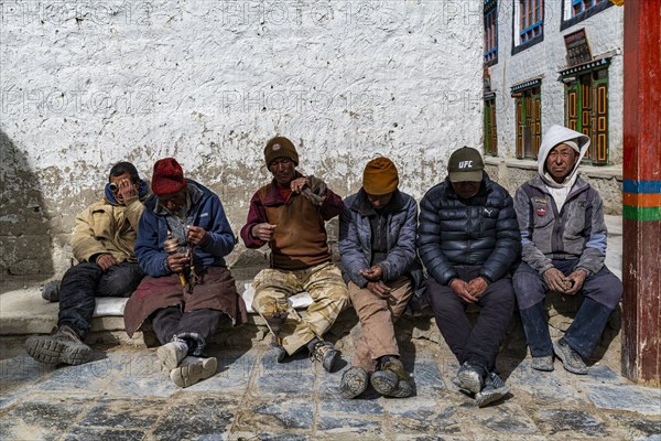 Local men having break, Lo Manthang, Kingdom of Mustang, Nepal, Asia