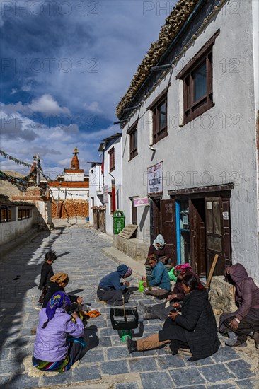 Local women practising traditional weaving in Lo-Manthang village, Kingdom of Mustang, Nepal, Asia