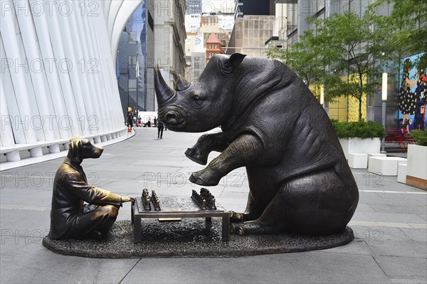 Bronze artwork for endangered animals, rhino and dog playing chess, exhibition A Wild Life for Wildlife, artists Gillie and Marc, in front of Oculus building, Transportation Hub, Ground Zero, Lower Manhattan, New York City, New York, USA, North America