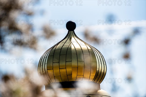 Close-up of a shiny golden dome with the sky in the background, Hundertwasser Kindergarten, Wuelfrath, Mettmann, North Rhine-Westphalia