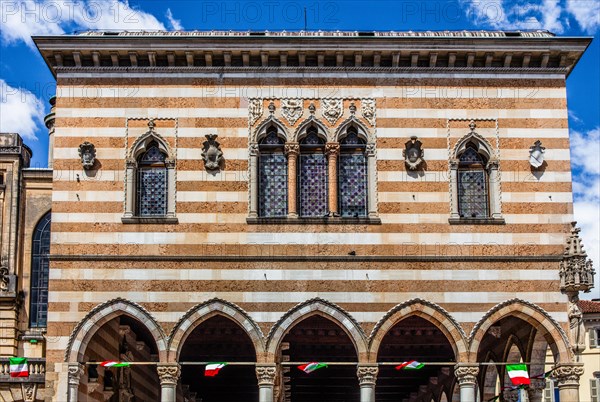 White and pink striped Loggia del Lionello in the finest Venetian Gothic style, 15th century in Piazza della Liberta, Udine, most important historical city in Friuli, Italy, Udine, Friuli, Italy, Europe