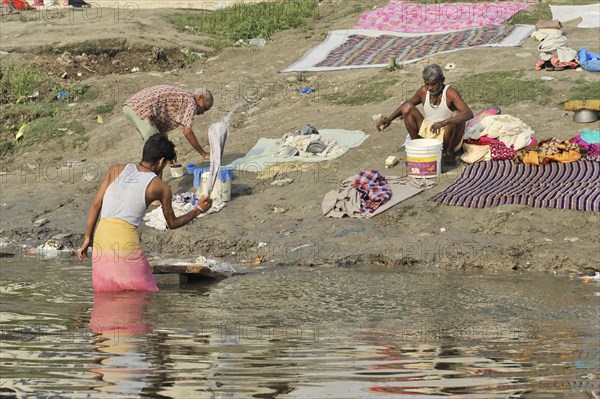 People washing clothes in the river, traditional outdoor scene, Varanasi, Uttar Pradesh, India, Asia