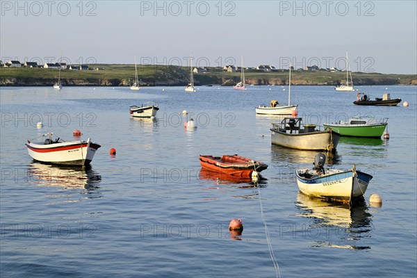 Boats on the blue waters of a bay, Ouessant Island, Finistere, Brittany, France, Europe