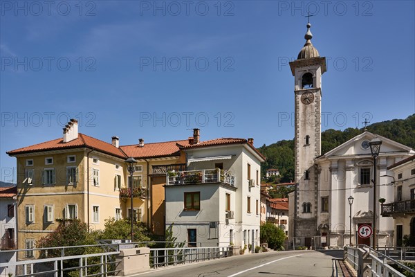 Canal ob Soci, picturesque village on the Soca river, trough gorge, in front the canal bridge over the Soca river, behind the parish church of the Assumption of the Virgin Mary, central Soska valley, Primorska region, Slovenia, Europe