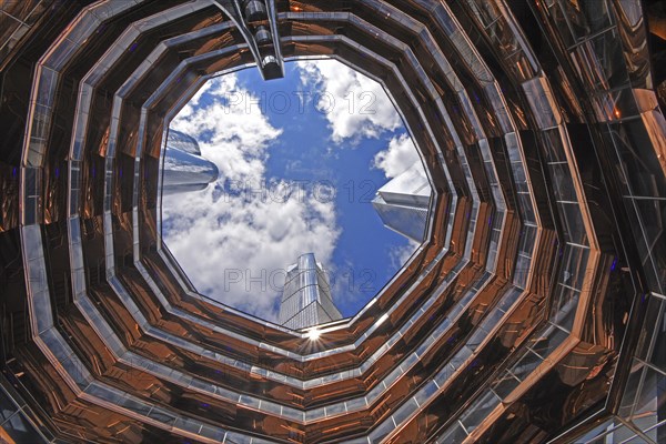 View of the sky and skyscraper spires inside The Vessel, Hudson Yards, Chelsea neighbourhood, West Manhattan, New York City, New York, USA, North America