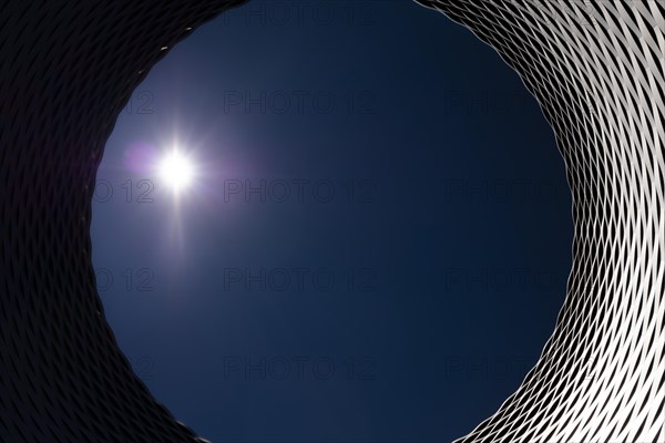 The Modern Building with Hole in Fair Basel with Clear Blue Sky and Sun in Switzerland