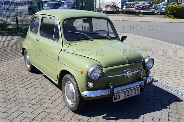 Front view of a green vintage Fiat parked on a cobbled street, Seat 600 E, Peine, Lower Saxony, Germany, Europe
