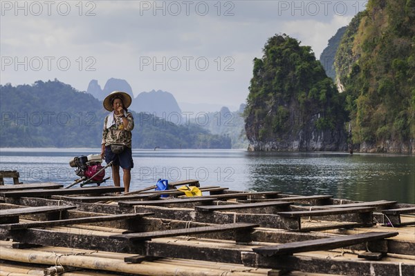 Woman on a raft in Cheow Lan Lake in Khao Sok National Park, limestone rock, woman, Asian, Asian, nature, travel, holiday, lake, reservoir, landscape, rock, rock formation, attraction, rock face, water, tourism, boat trip, excursion, boat trip, nature reserve, travel photo, Thailand, Asia
