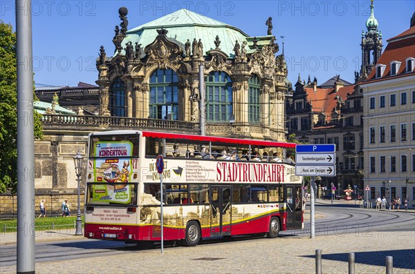 A red double-decker bus for city tours in front of the Zwinger on Sophienstrasse in Dresden, Saxony, Germany, for editorial use only, Europe