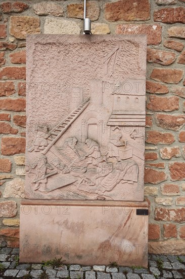 Memorial stone with relief for the construction of the church, sandstone, red, construction worker, ladder, figures, church square, Otterberg, Palatinate Forest, Rhineland-Palatinate, Germany, Europe