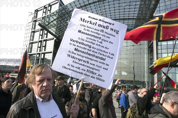 A participant in the Merkel muss weg demo. Demonstration by right-wing populist and far-right participants, including supporters of the NPD, Pegida, Reichsbuerger, hooligans, Landsmannschaften and Identitarians, Berlin, 4 March 2017