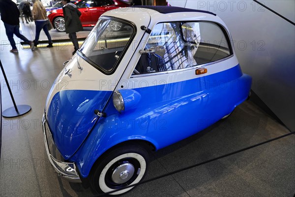 A classic blue and white small car presented in an exhibition hall, BMW WELT, Munich, Germany, Europe
