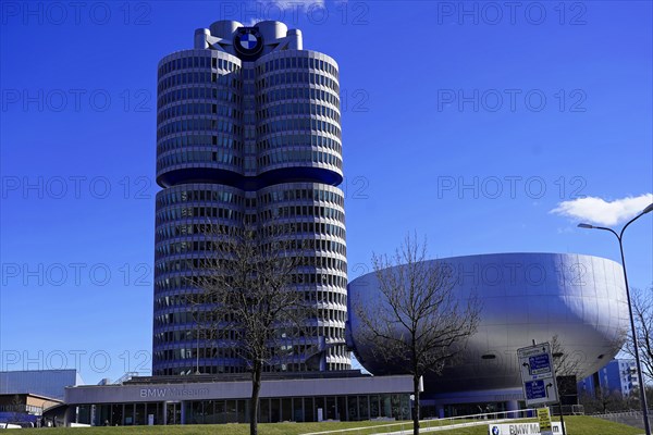 BMW Welt next to the cylindrical BMW Museum building on a sunny day, BMW WELT, Munich, Germany, Europe