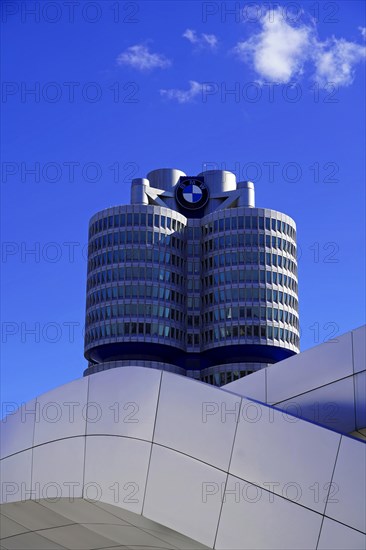 Partial view of the BMW headquarters with company logo against a clear sky, BMW WELT, Munich, Germany, Europe