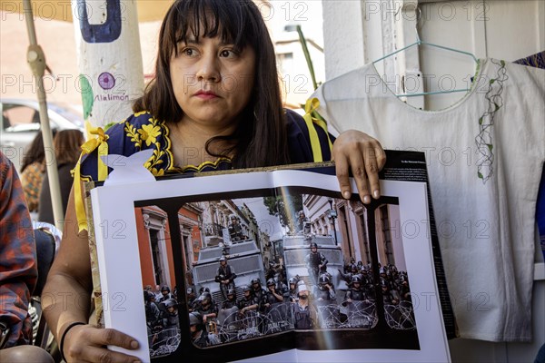 Oaxaca, Mexico, Alejandra Canseco Alhil discusses the 2006 protests in Oaxaca with foreign visitors. She was one of the leaders of the Popular Assembly of the Peoples of Oaxaca (APPO), which took control of the city for several months. She had to flee the city after the government regained control, but now operates an art studio there, Central America