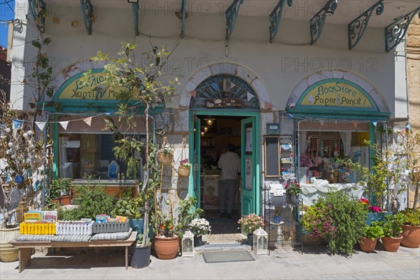 An inviting bookshop with an open door and a wide variety of articles in the entrance area, Koroni Old Town, Pylos-Nestor, Messinia, Peloponnese, Greece, Europe