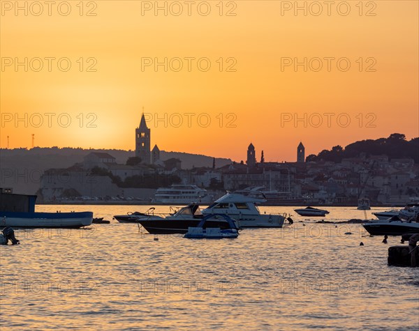 Boats anchoring in a bay, silhouette of church towers, evening mood after sunset over Rab, town of Rab, island of Rab, Kvarner Gulf Bay, Croatia, Europe