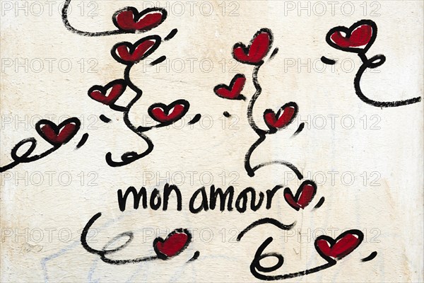 Street art, painted house wall with hearts and lettering on the theme of love, Montmartre, Paris, Ile-de-France, France, Europe