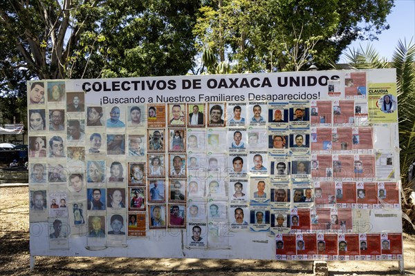 Oaxaca, Mexico, A billboard in the zocalo shows the faces of persons who have disappeared. Over the years, many have disappeared at the hands of gangs or corrupt police, Central America