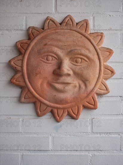 Terracotta sun for garden and house decoration, North Rhine-Westphalia, Germany, Europe