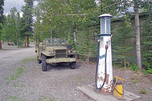 Jeep and petrol station from the 1940s, old US Army camp, Yukon Discvery Lodge, Alaska Highway, Yukon, Canada, North America