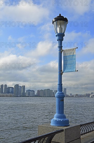 Street light marking the potential future flood level caused by global warming, Hudson River, Lower Manhattan, New York City, New York, USA, North America