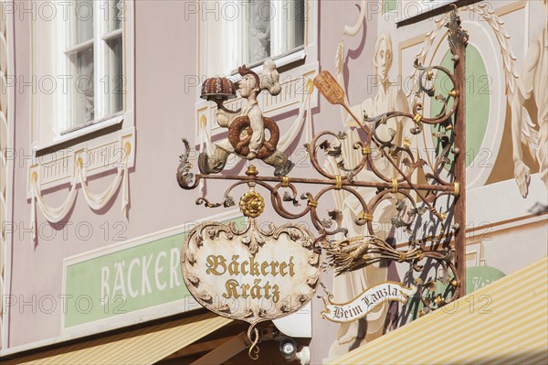 Old, decorated hanging sign of the Kraetz bakery in Ludwigstrasse, Partenkirchen district, Garmisch-Partenkirchen, Werdenfelser Land, Upper Bavaria, Bavaria, Germany, Europe
