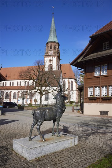 Stag sculpture and St Blasius church in Glottertal, Breisgau-Hochschwarzwald district, Baden-Wuerttemberg, Germany, Europe