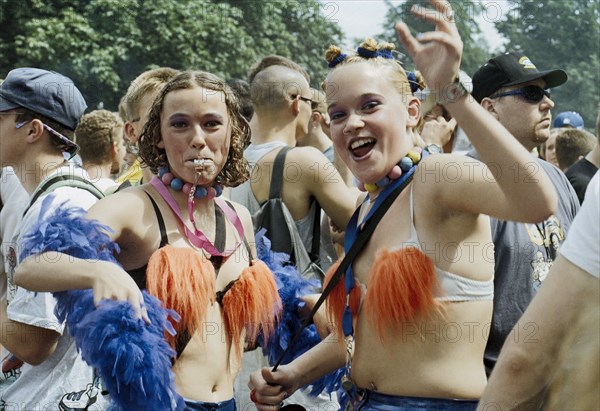 Techno fans celebrate during the Love Parade. Under the motto Let the sun shine to your heart, techno music fans celebrate the 9th Love Parade with more than a million visitors in Berlin on 12 July 1997