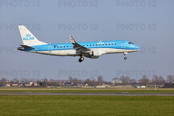 KLM Cityhopper Embraer E175STD with the registration PH-EXT approaching the Polderbaan, Amsterdam Schiphol Airport in Vijfhuizen, municipality of Haarlemmermeer, Noord-Holland, Netherlands