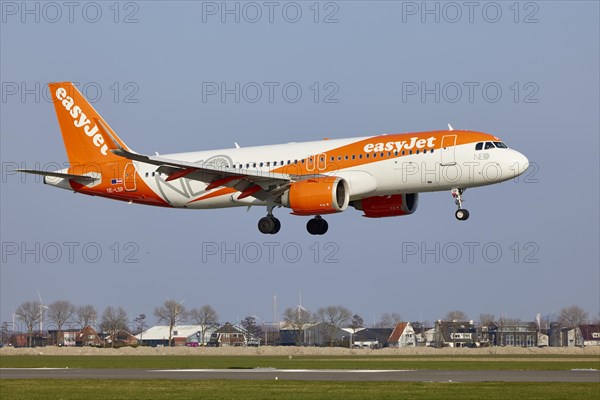EasyJet Europe Airbus A320-251N with the registration OE-LSP (special livery NEO Livery) approaching the Polderbaan, Amsterdam Schiphol Airport in Vijfhuizen, municipality of Haarlemmermeer, Noord-Holland, Netherlands