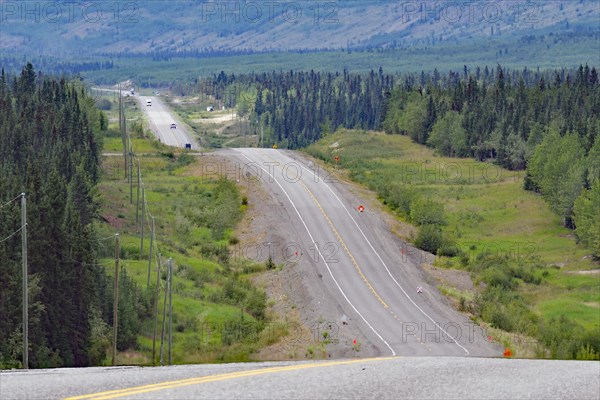 Road leads as endless grades through wilderness, constant ups and downs, Alaska Highway, Yukon Territory, Canada, North America