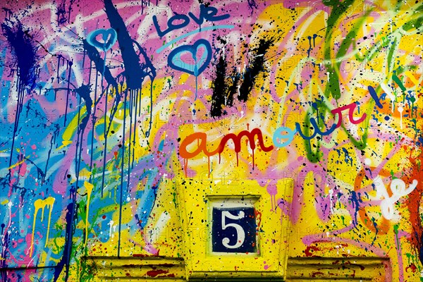 Street art, painted house wall with hearts and lettering on the theme of love, Montmartre, Paris, Ile-de-France, France, Europe