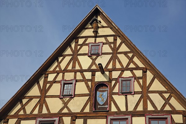 Gable with figures, house wall, half-timbered house, window, brown, yellow, detail, Hotel Loewen, Marktbreit, Lower Franconia, Franconia, Bavaria, Germany, Europe