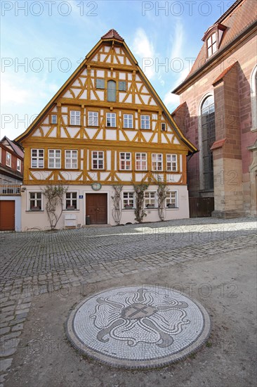 Half-timbered rector's house built in the 16th century and Luther's rose as a symbol of the Evangelical-Lutheran church, Doktor-Martin-Luther-Platz, Bad Windsheim, Middle Franconia, Franconia, Bavaria, Germany, Europe