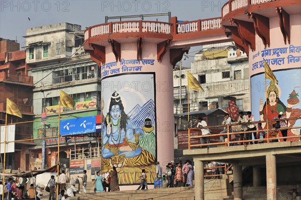 Traditional religious paintings on a building with people and pillars, Varanasi, Uttar Pradesh, India, Asia