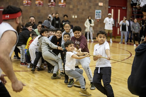 Hamtramck, Michigan USA, 8 March 2024, Arab-Americans from Hamtramck and Dearborn, Michigan faced off in a charity fundraising basketball game and, during halftime, a children's tug-of war. The event raised money for charities in Palestine and Yemen