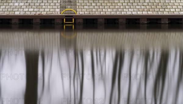 Long exposure, reflection of trees in the water of the Spree, Am Schleusenkanal, Berlin, Germany, Europe