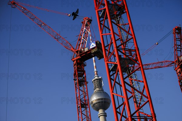 Symbolic photo on the topic 'Aeo Building in Berlin 'Aeo. Construction cranes stand on a building site on Alexanderplatz in front of the television tower. Berlin, 05.03.2024