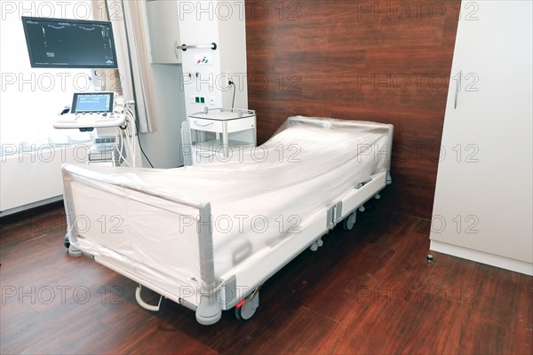 An ultrasound machine stands next to the patient's bed in a hospital room in Berlin, 25 January 2019