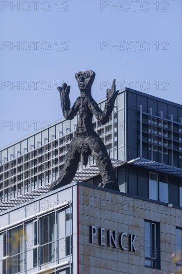 On the acute-angled corner of the building at the junction of Maxstrasse and Ostra-Allee stands a four-metre bronze sculpture of a stick figure created by A. R. Penck, Dresden, Saxony, Germany, Europe